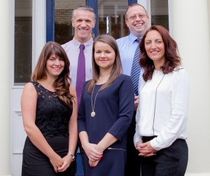 A picture of Gina, Tim, Annabel, Phil and Carly smiling